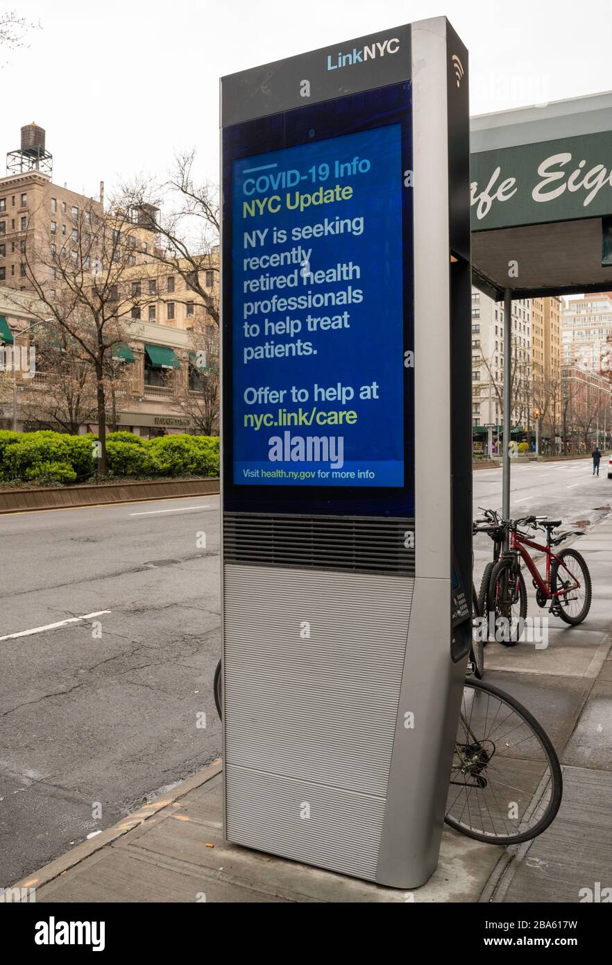 NEW YORK, NY - MARCH 25, 2020. Public Service messages about the Coronavirus outbreak are displayed on a LinkNYC kiosk on the Upper West Side of Manhattan in New York City. The World Health Organization declared coronavirus (COVID-19) a global pandemic on March 11th. Stock Photo