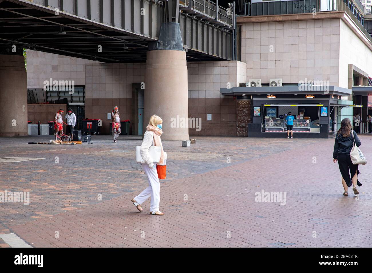 Coronavirus Sydney, elderly woman at circular quay wearing face mask as protection against the disease Stock Photo
