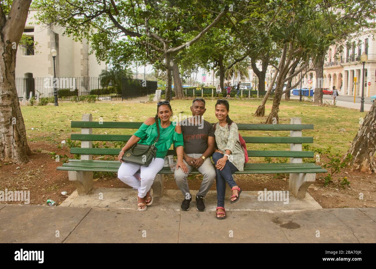 Cuban with tourist in a Havana Park, Havana, Cuba Stock Photo