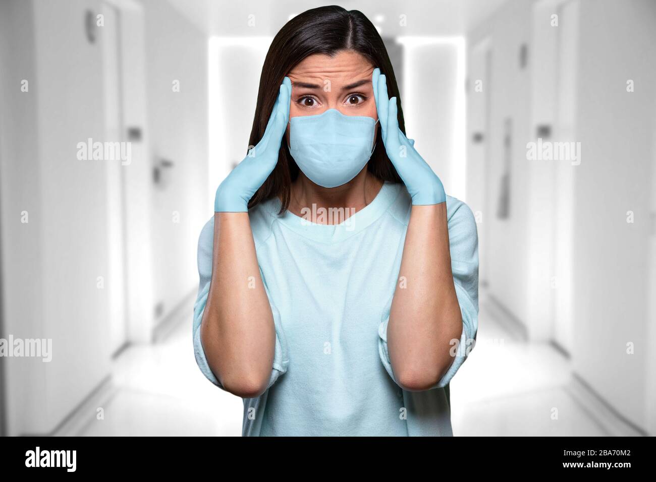Hospital staff in distress, panicked, overwhelmed from emergency situation during health crisis female asian american medical worker Stock Photo
