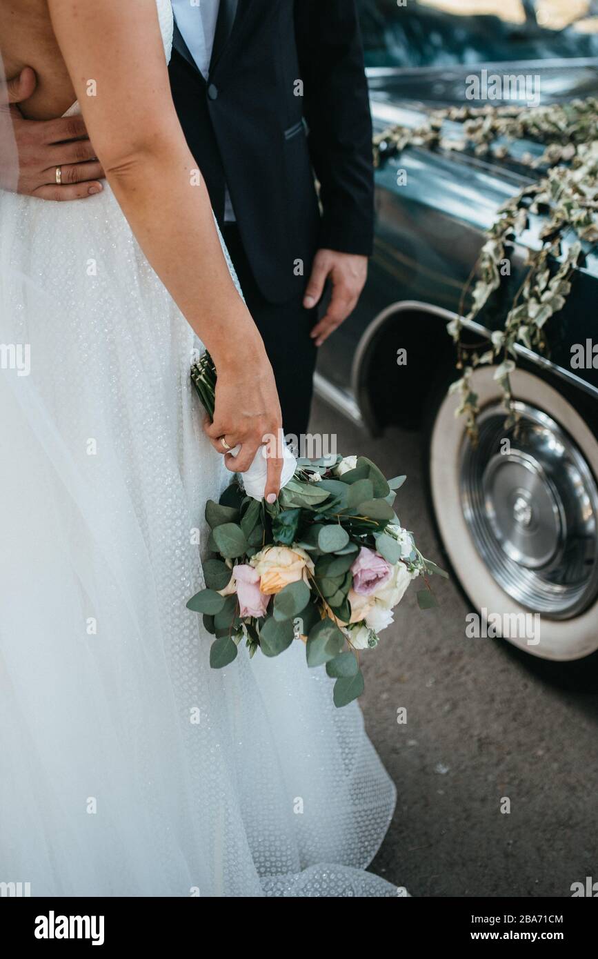 The bride in a beautiful wedding dress and her bridal bouquet of ...