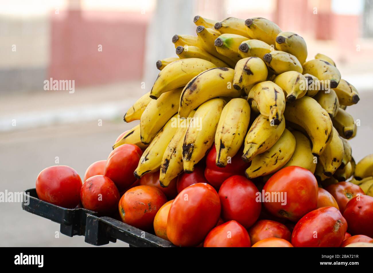Bananas and tomatoes for sale in the streets of Trinidad in Cuba Stock Photo