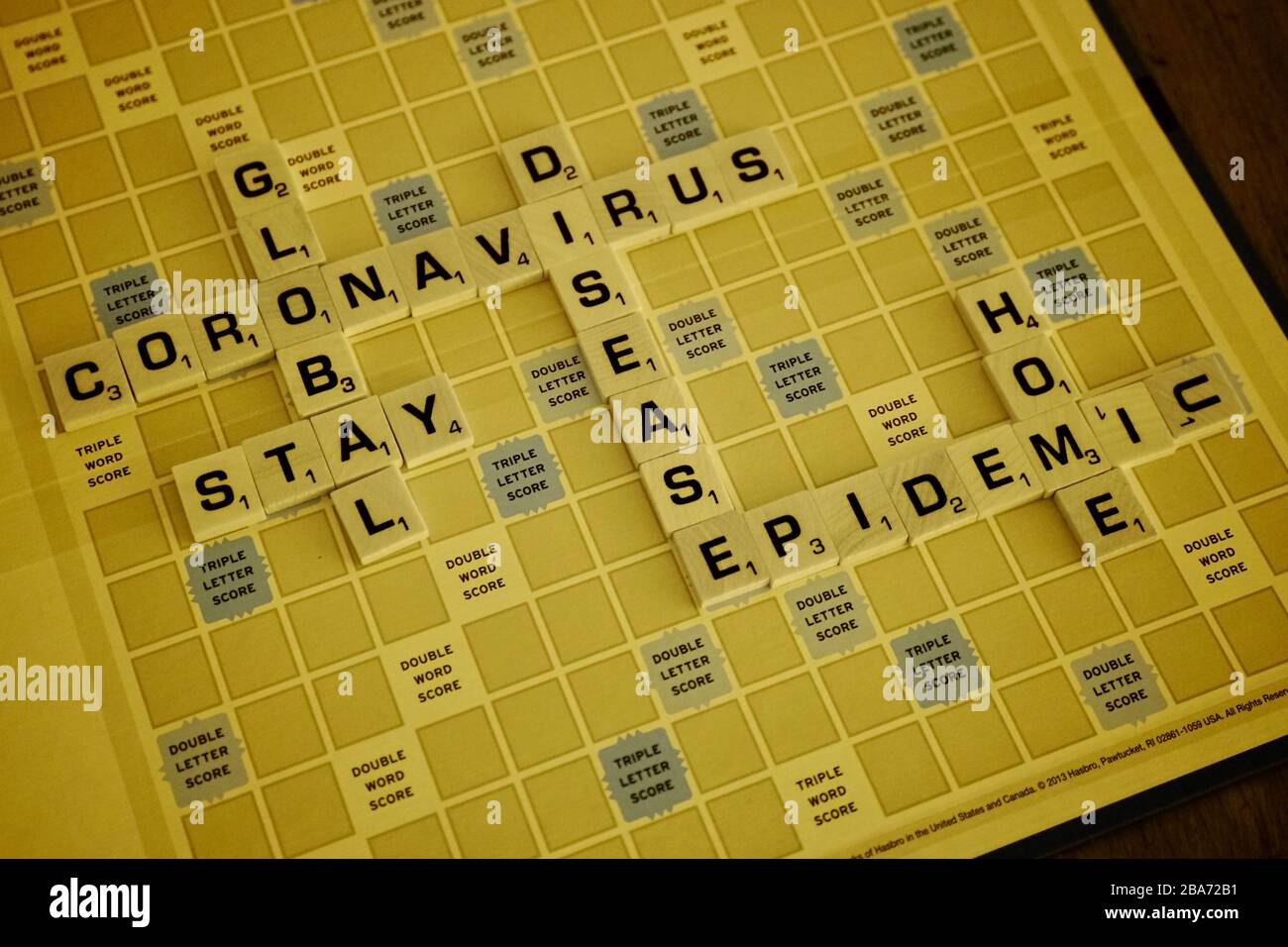 A monopoly board with words regarding the Coronavirus in infrared. Stock Photo