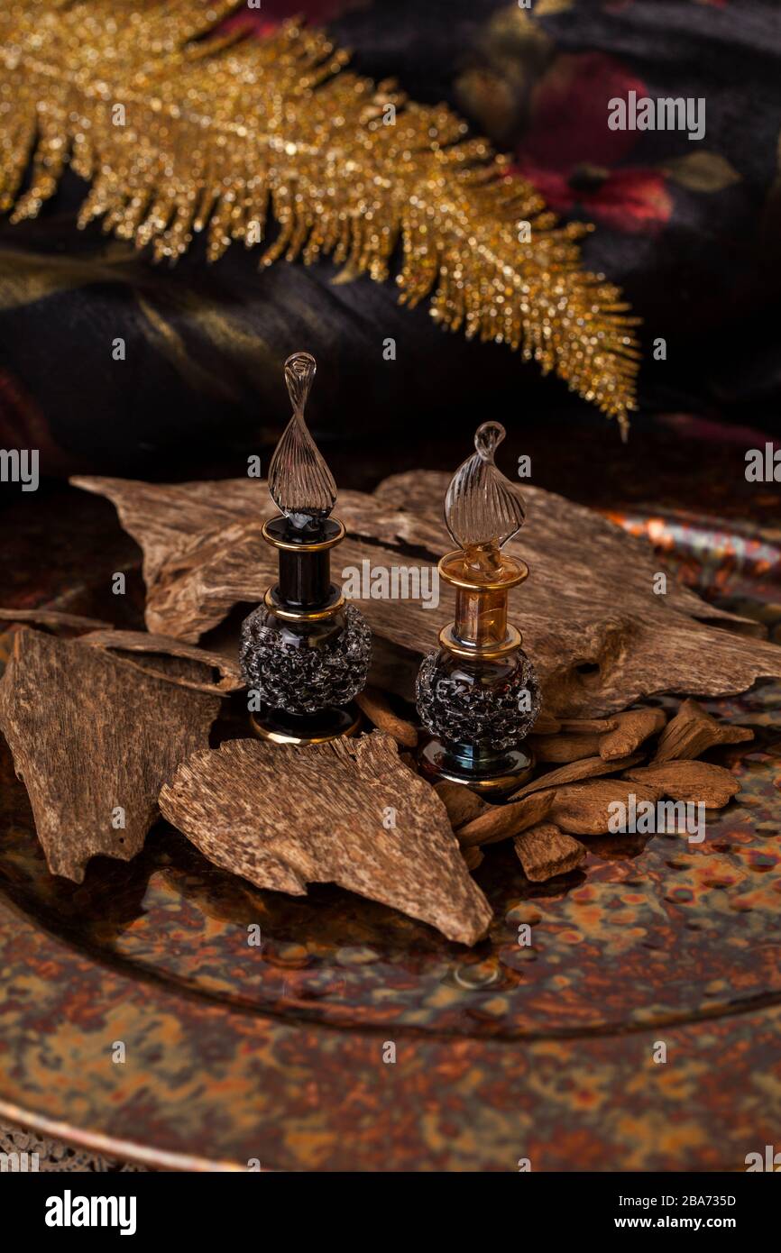 Agarwood, also called aloeswood, essential oil and incense chips Stock Photo