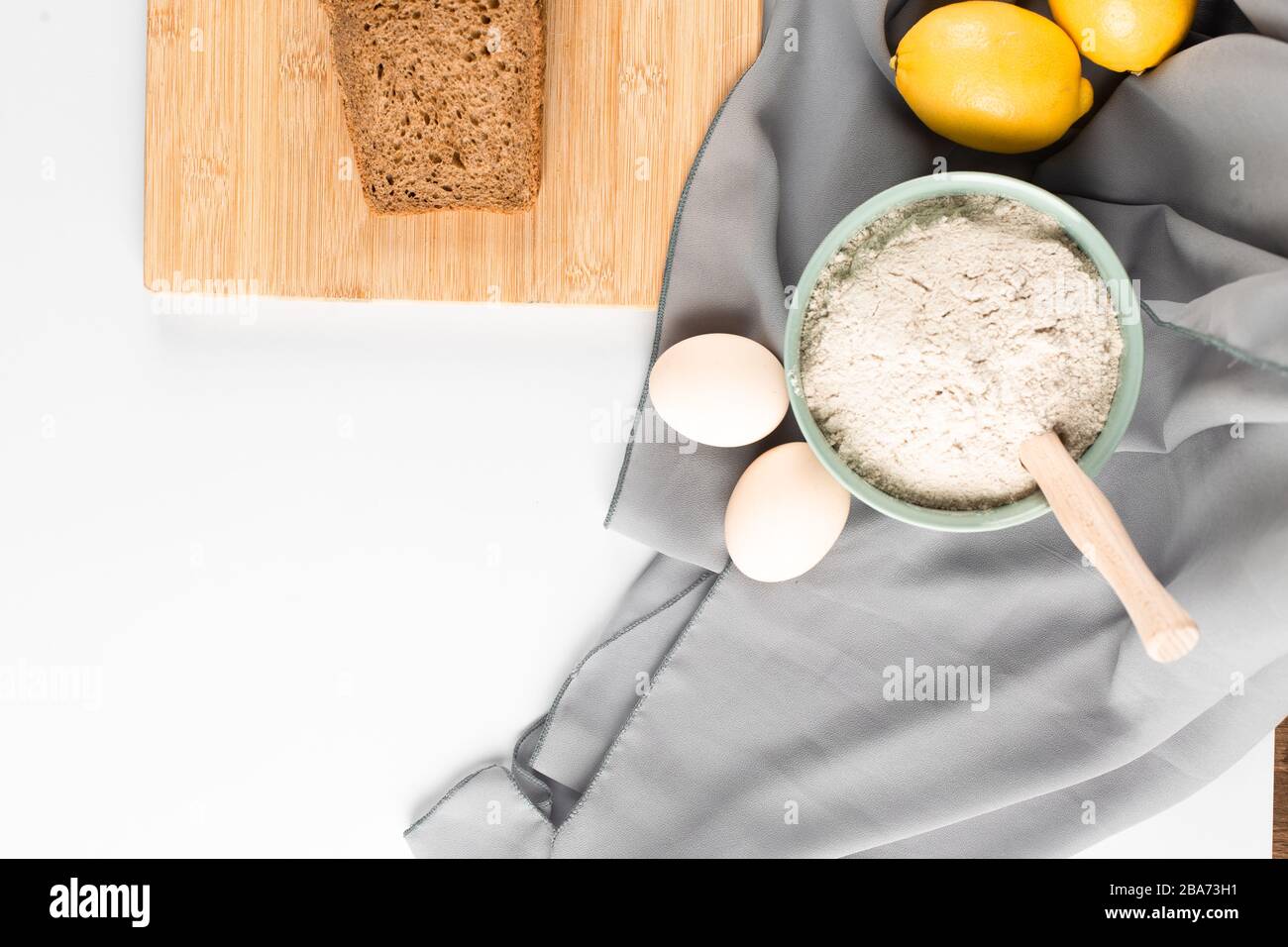 Slice of bread, flour and eggs on the table Stock Photo Alamy