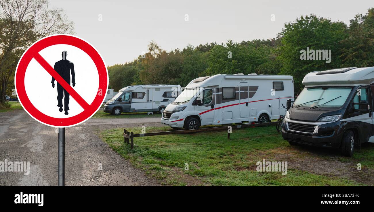 Prohibition sign of people walking in camper park. Quarantine self-isolation Stock Photo
