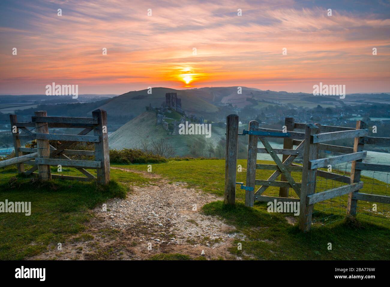 Corfe Castle, Dorset, UK.  26th March 2020.  UK Weather.   A light frost covers the ground at sunrise at Corfe Castle in Dorset after a night of freezing temperatures.  Picture Credit: Graham Hunt/Alamy Live News Stock Photo