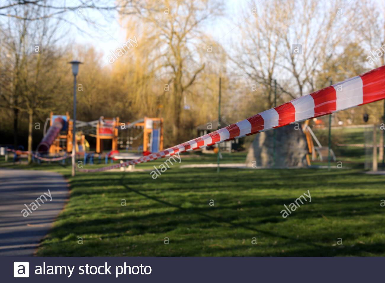 A closed-off, deserted playground in Coburg, Bavaria, this morning as strict rules concerning movement outside the home continue to be implemented. Pe Stock Photo