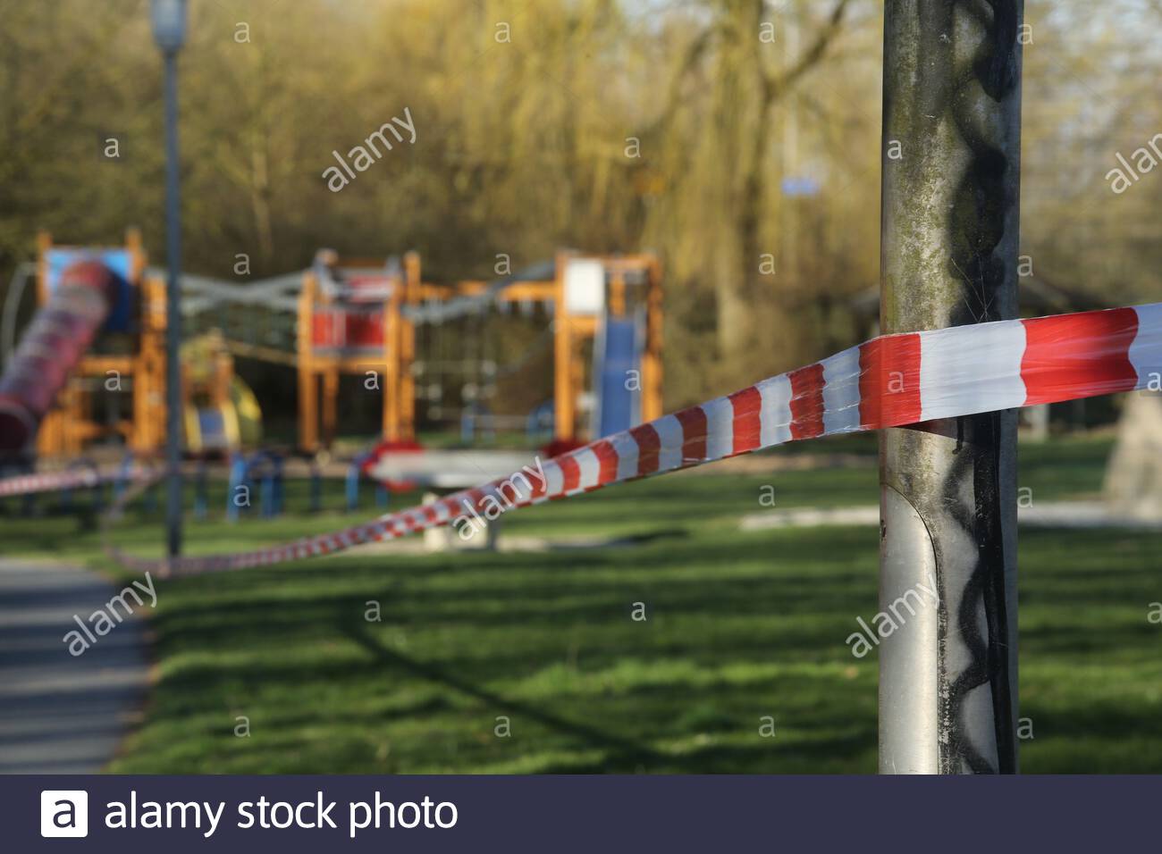 A closed-off, deserted playground in Coburg, Bavaria, this morning as strict rules concerning movement outside the home continue to be implemented. Stock Photo
