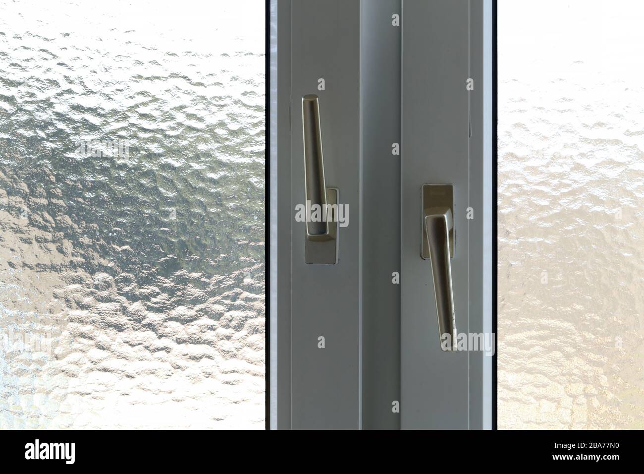 Window in the bathroom with hinged doors Stock Photo