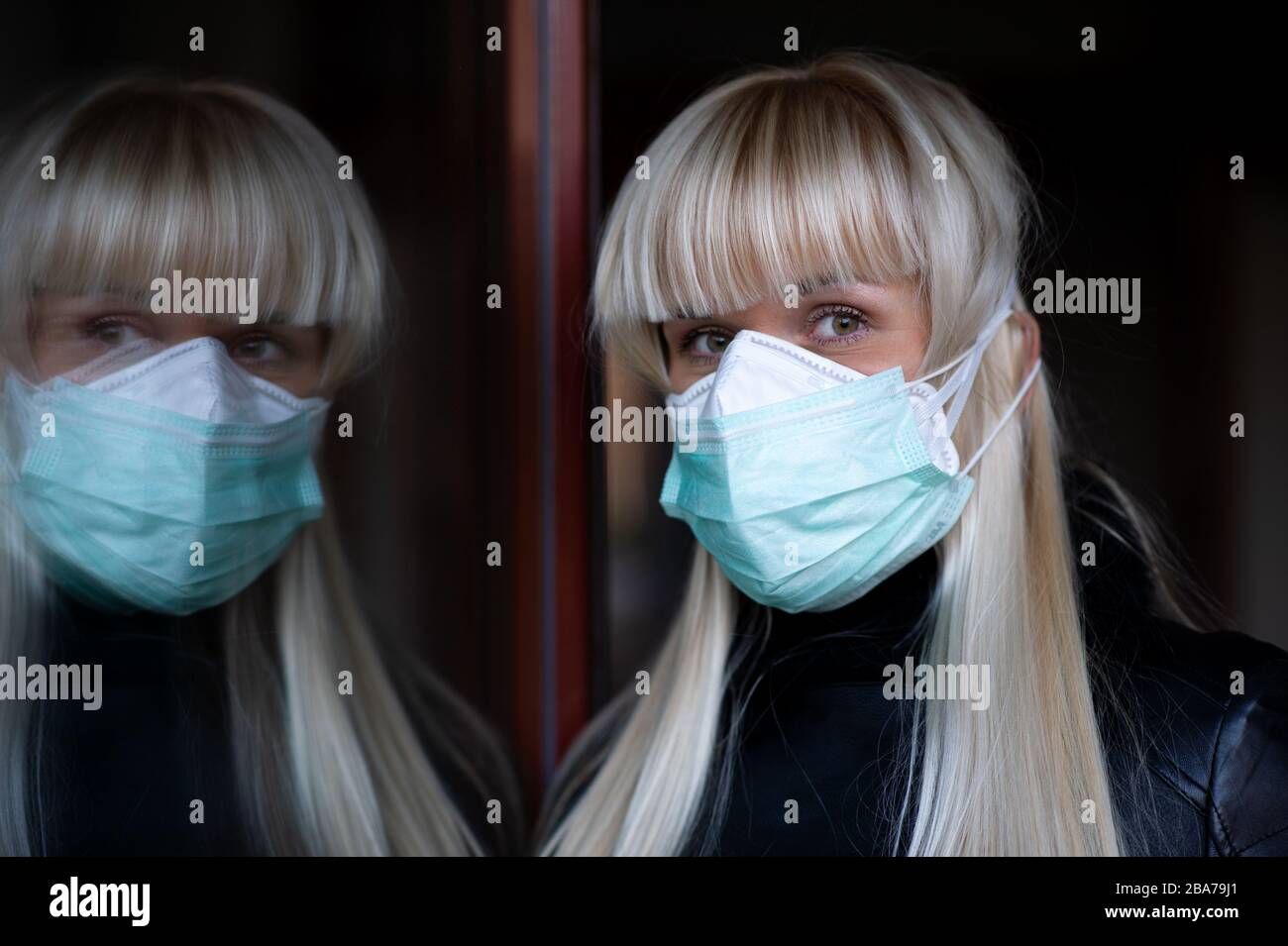 Blonde woman with a protection face mask and FFP3 respirator is seen in  Prague, Czech Republic, on March 25, 2020. (CTK Photo/Martin Kabat Stock  Photo - Alamy