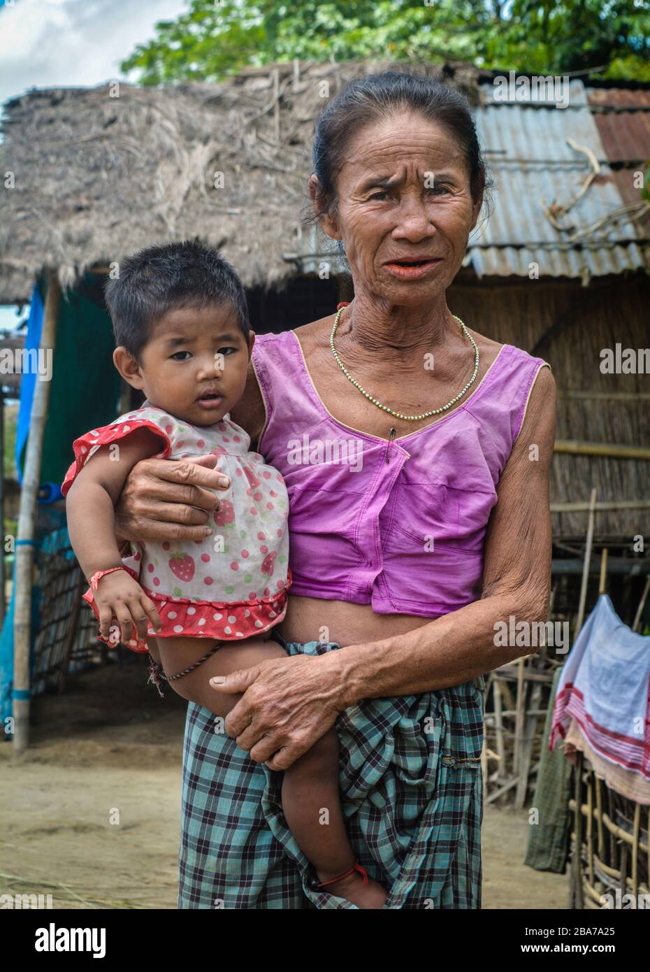 Portrait of a Mishing Tribe Woman with her Grandson. Stock Photo