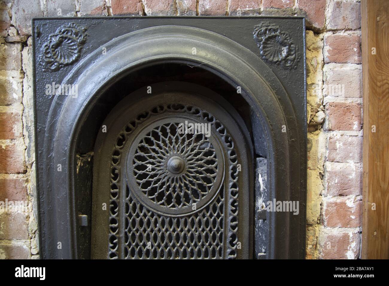 Closeup shot of a fireplace metal door Stock Photo