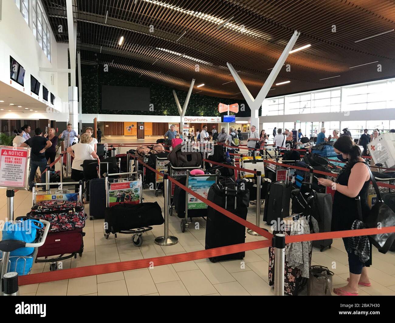 (200326) -- SUVA, March 26, 2020 (Xinhua) -- Outbound passengers are seen in Nadi International Airport in Suva, Fiji, March 26, 2020. As a 31-year-old Fijian woman tested positive, the infections in Fiji have reached five. Starting from Thursday, the main international airport of Fiji, the Nadi International airport will be officially shut down to all scheduled passenger travel while passenger travel to the outer islands will cease from Sunday. (FIJI SUN/Handout via Xinhua) Stock Photo