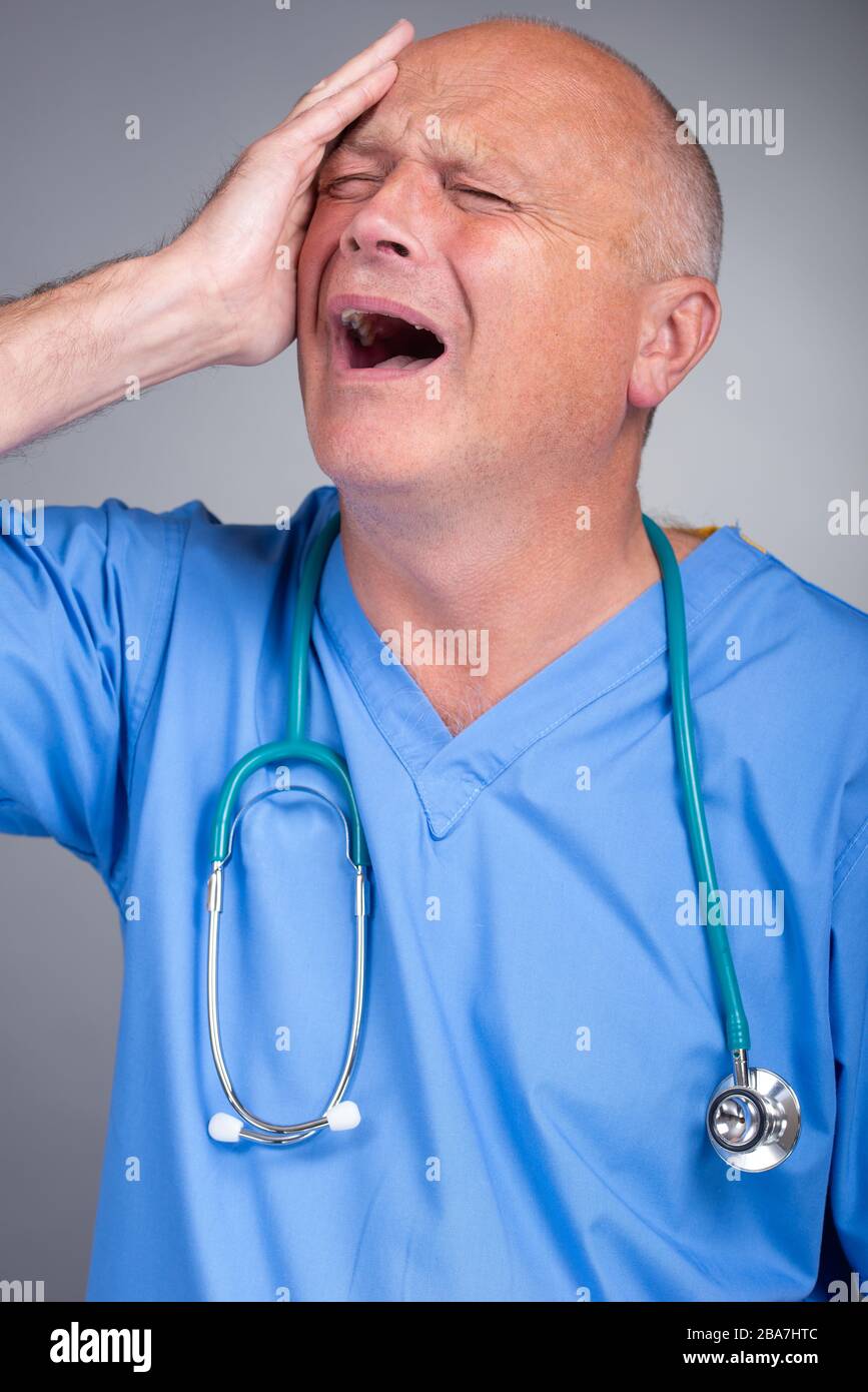 Doctor wearing stethoscope around his neck hires stock photography and