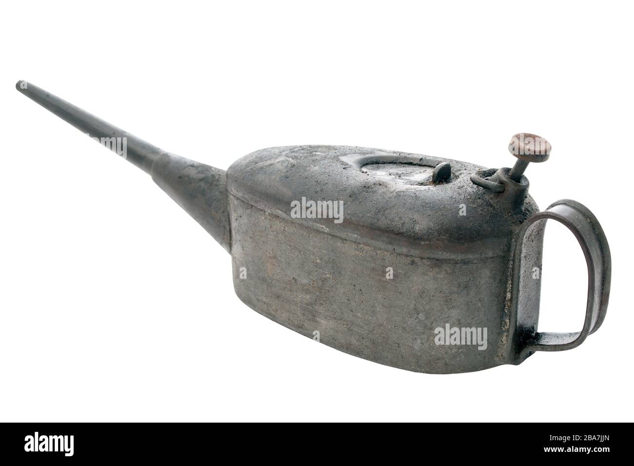 Vintage oil container coated in grease and dust from years of use on an isolated white background with a clipping path Stock Photo