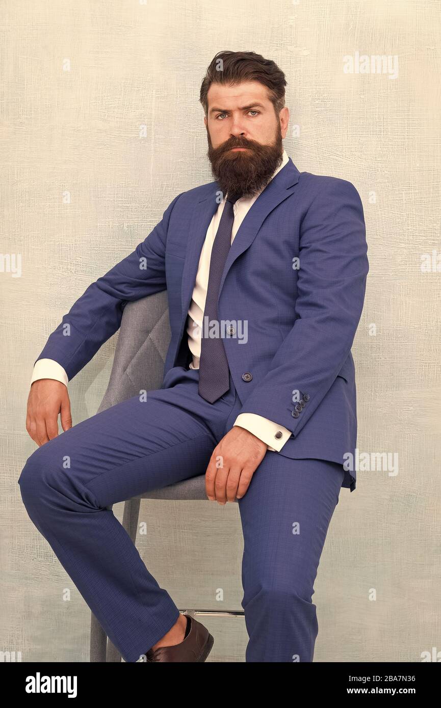 He is sure to impress. Confident businessman. Businessman sit on chair