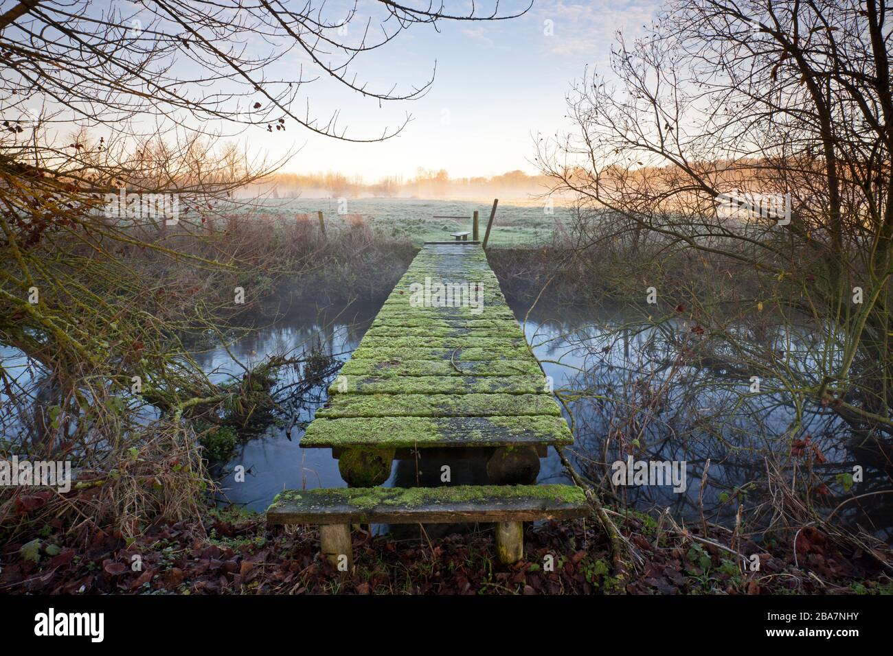 A footbridge on the River Wylye near the village of Hanging Langford in Wiltshire. Stock Photo