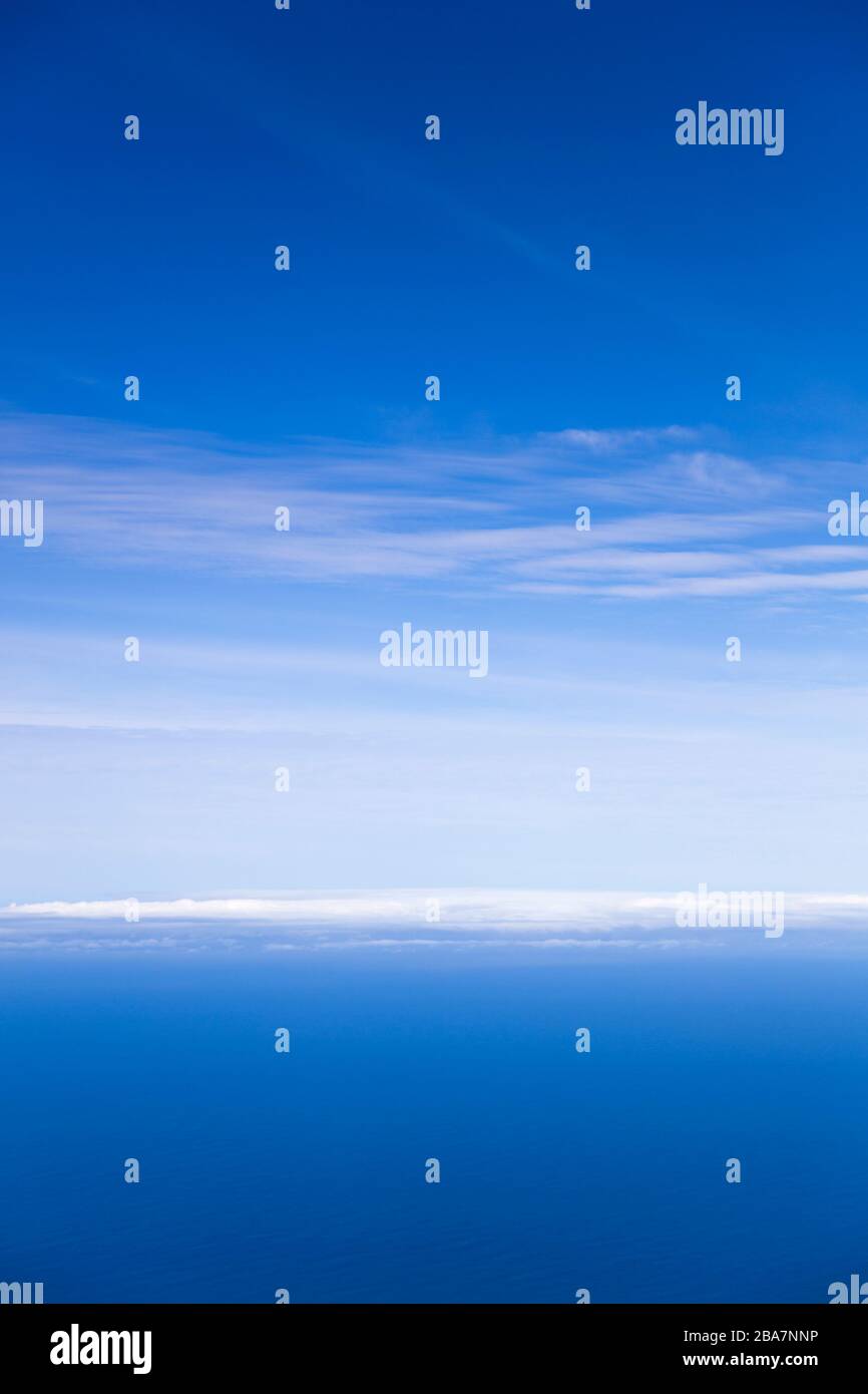 Calm blue sea and sky horizon with clouds Stock Photo - Alamy