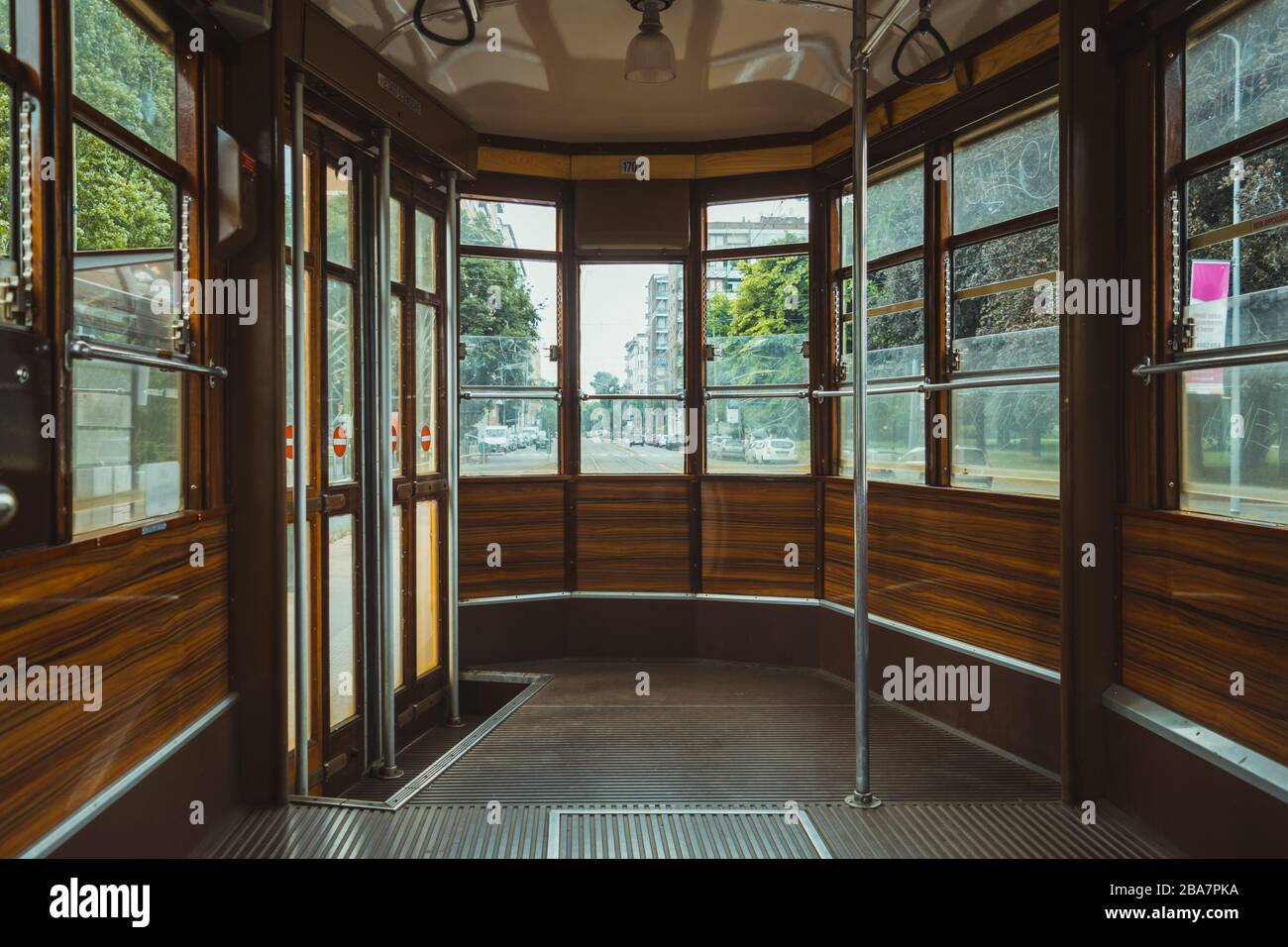 Empty old fashioned tram interior in Milan, Italy Stock Photo