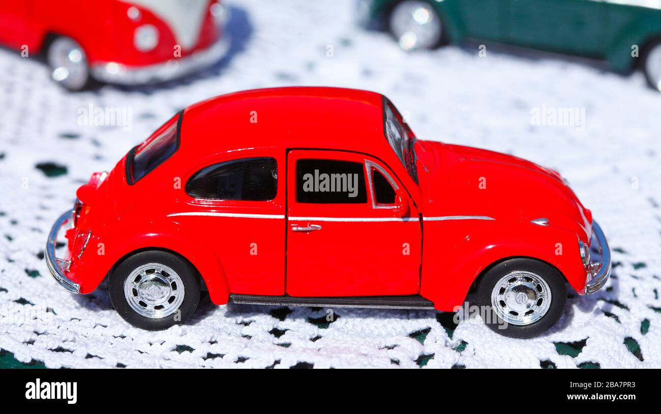 Old red VW Beetle toy vehicle at a flea market Stock Photo