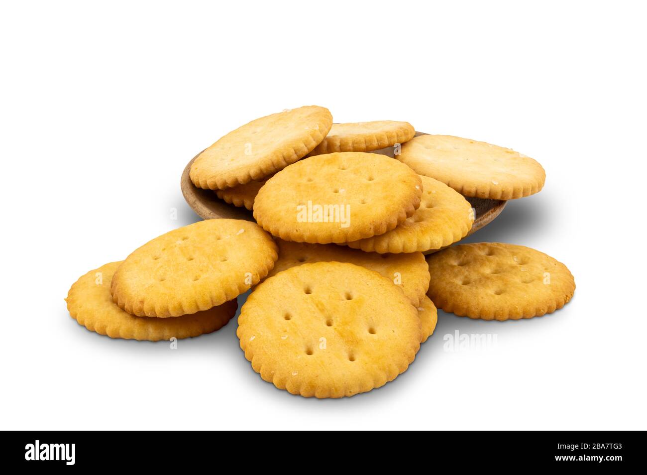 Pile of round crackers and wooden plate on white background with clipping path Stock Photo