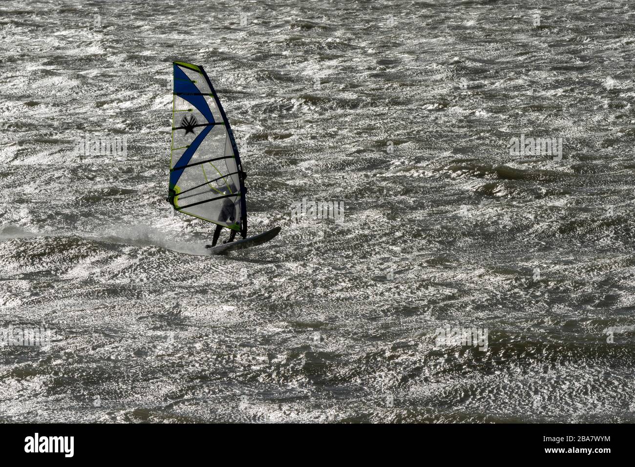 Windsurfer off Hayling Island in high wind Stock Photo