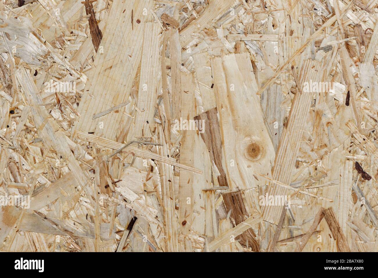 OSB Construction Wood Background - Detail: closeup section of an oriented strand board, made of different kinds of softwood strands Stock Photo