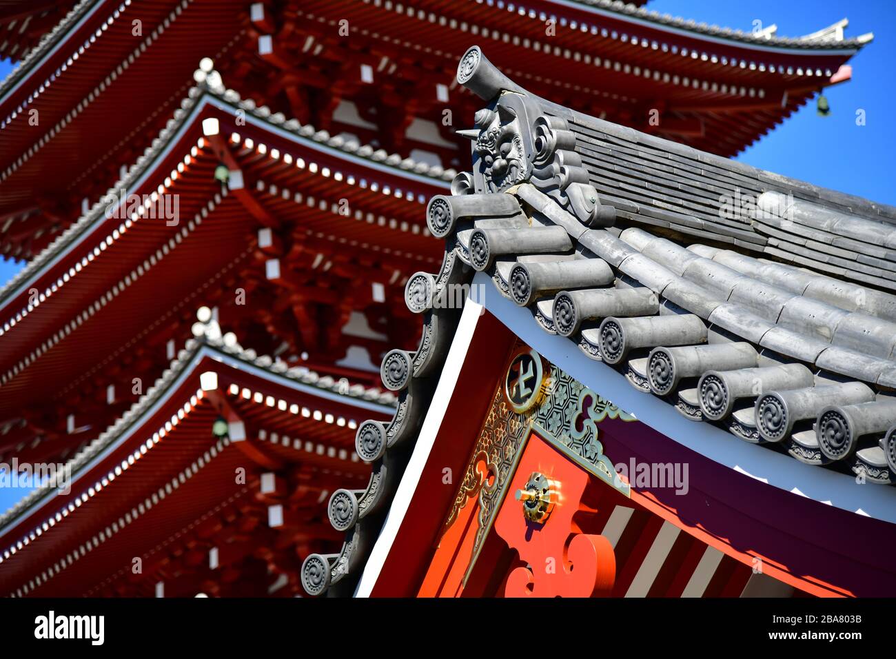 Tokyo, Japan - October 2019: low angle close up view of the Sensoji temple in Tokyo with its characteristic structure in bright red Stock Photo