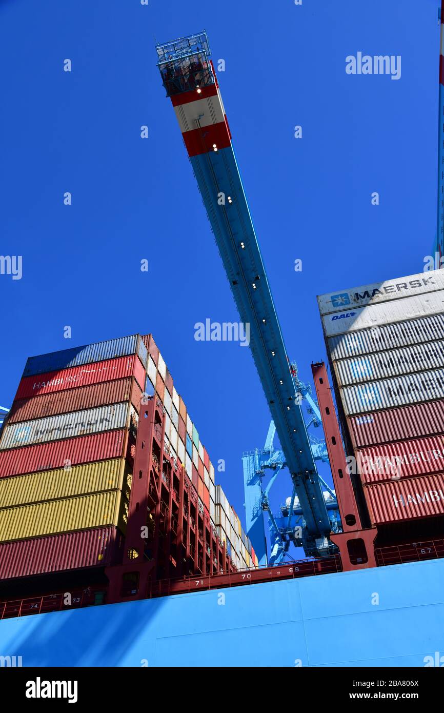 Rotterdam, The Netherlands - August 2019; low angle view and image filling section of container handling; ship to shore in the terminal with gantry cr Stock Photo