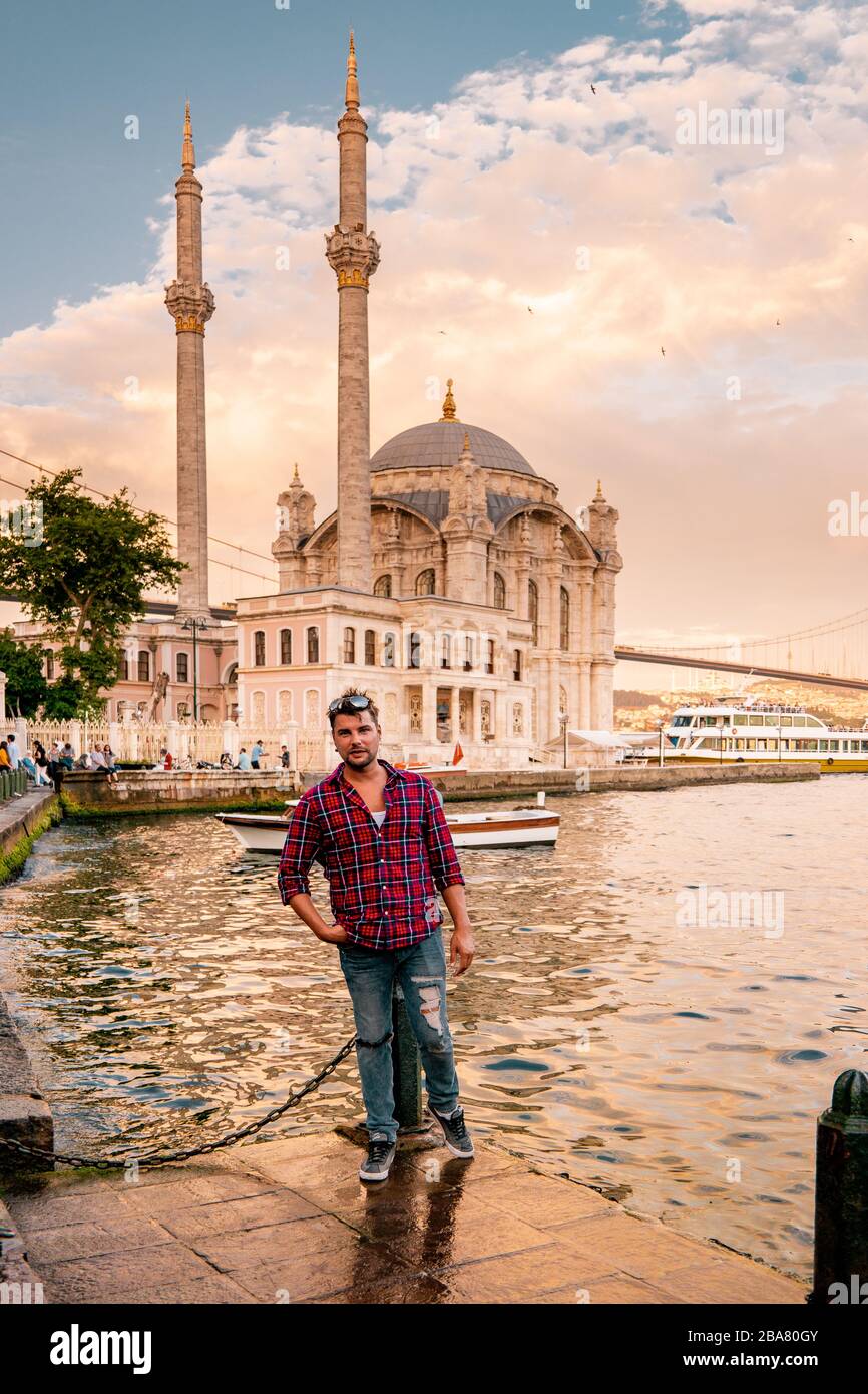 Istanbul Turkey ,Ortakoy neighbourhood of Istanbul located by the Bosphorus coastline on the European side , Ortakoy mosque in istanbul, turkey Stock Photo
