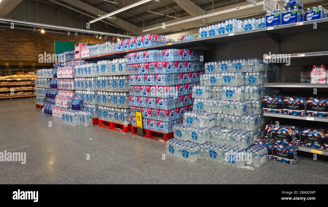 Stocks of drinking water on shelves in Morrisons supermarket in