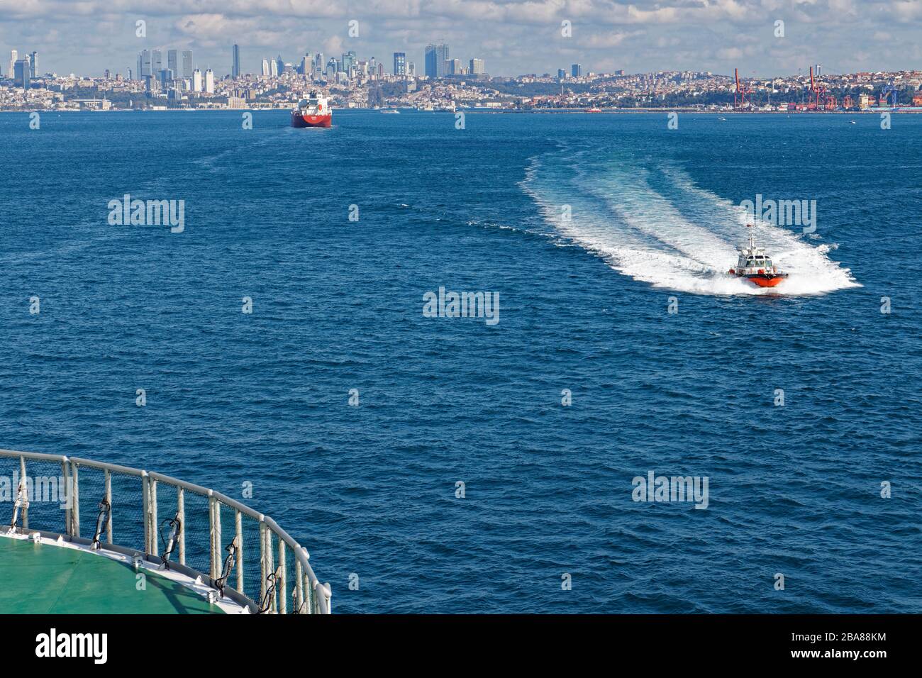 A Turkish Pilot Boat making a fast approach to a Seismic Vessel, about to transit through the Bosphorus Straits Stock Photo