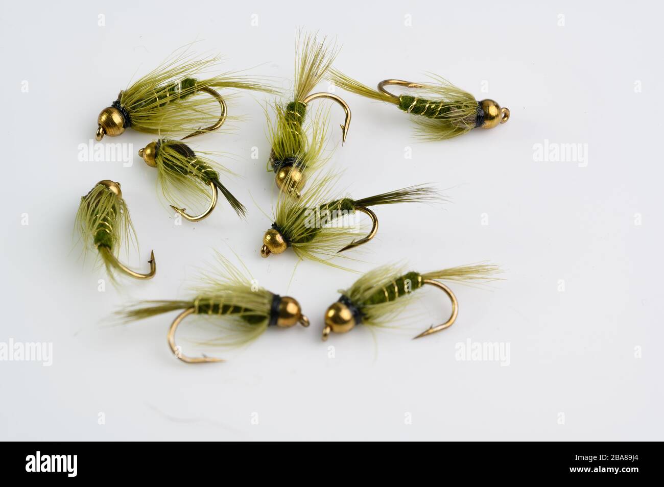 Selection of Rough Olive Gold bead hed Nymphs fly fishing Flies Stock Photo