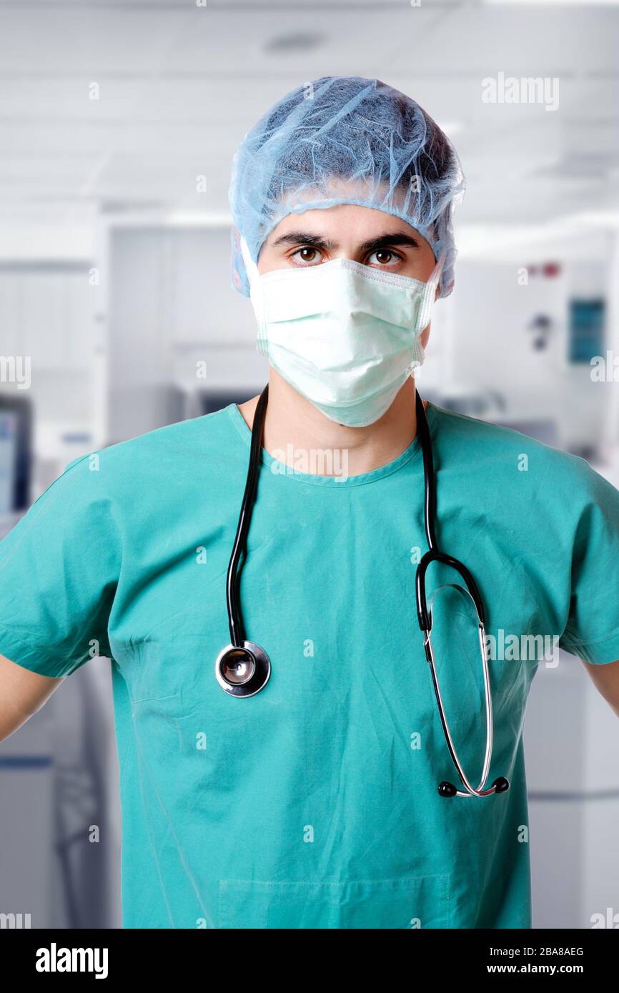 Male doctor wearing a face mask at the hospital Stock Photo - Alamy