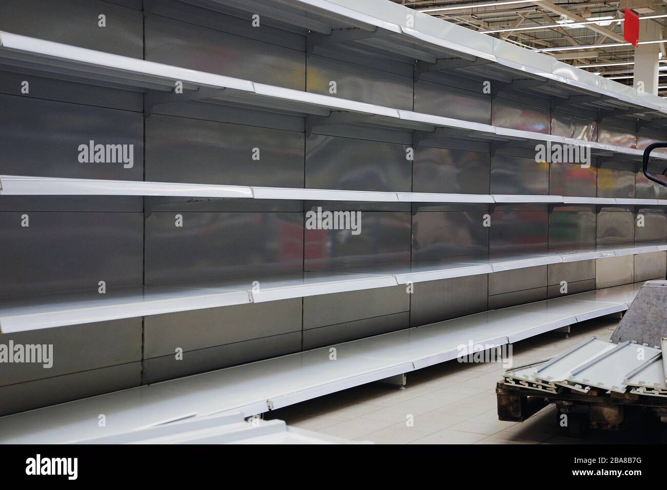 Empty shelves in large grosery store Stock Photo