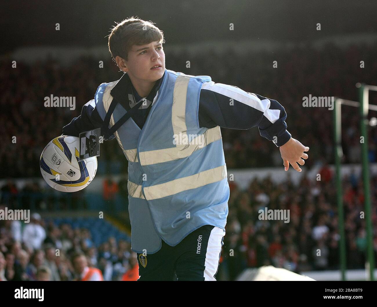 A Leeds United's ball boy who was later told off by a steward for delaying giving the ball back during the game against Nottingham Forest Stock Photo