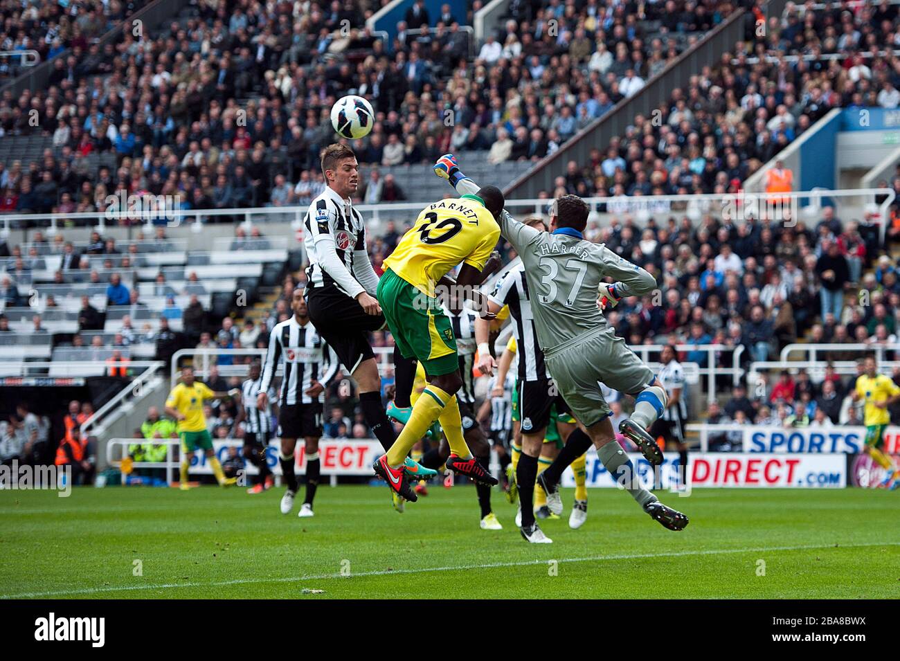 Newcastle United's goalkeeper Steve Harper punches the ball under