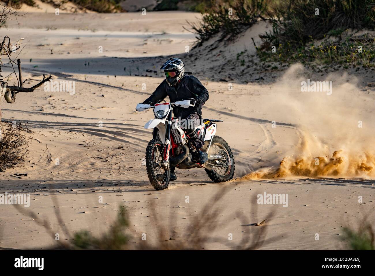 Dirt bike on a sand dune Stock Photo Alamy
