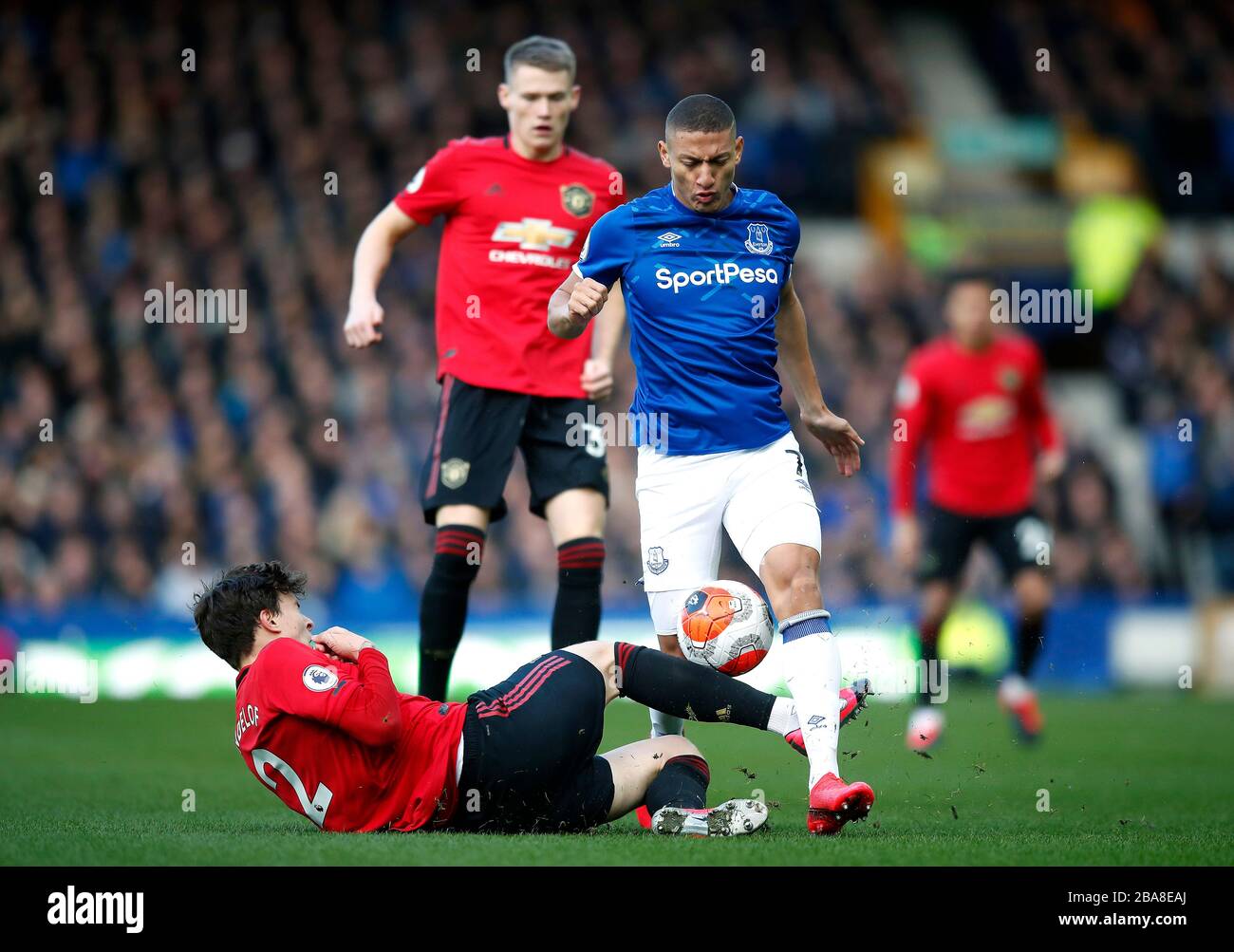 Everton's Richarlison (top) and Manchester United's Victor Lindelof battle for the ball Stock Photo