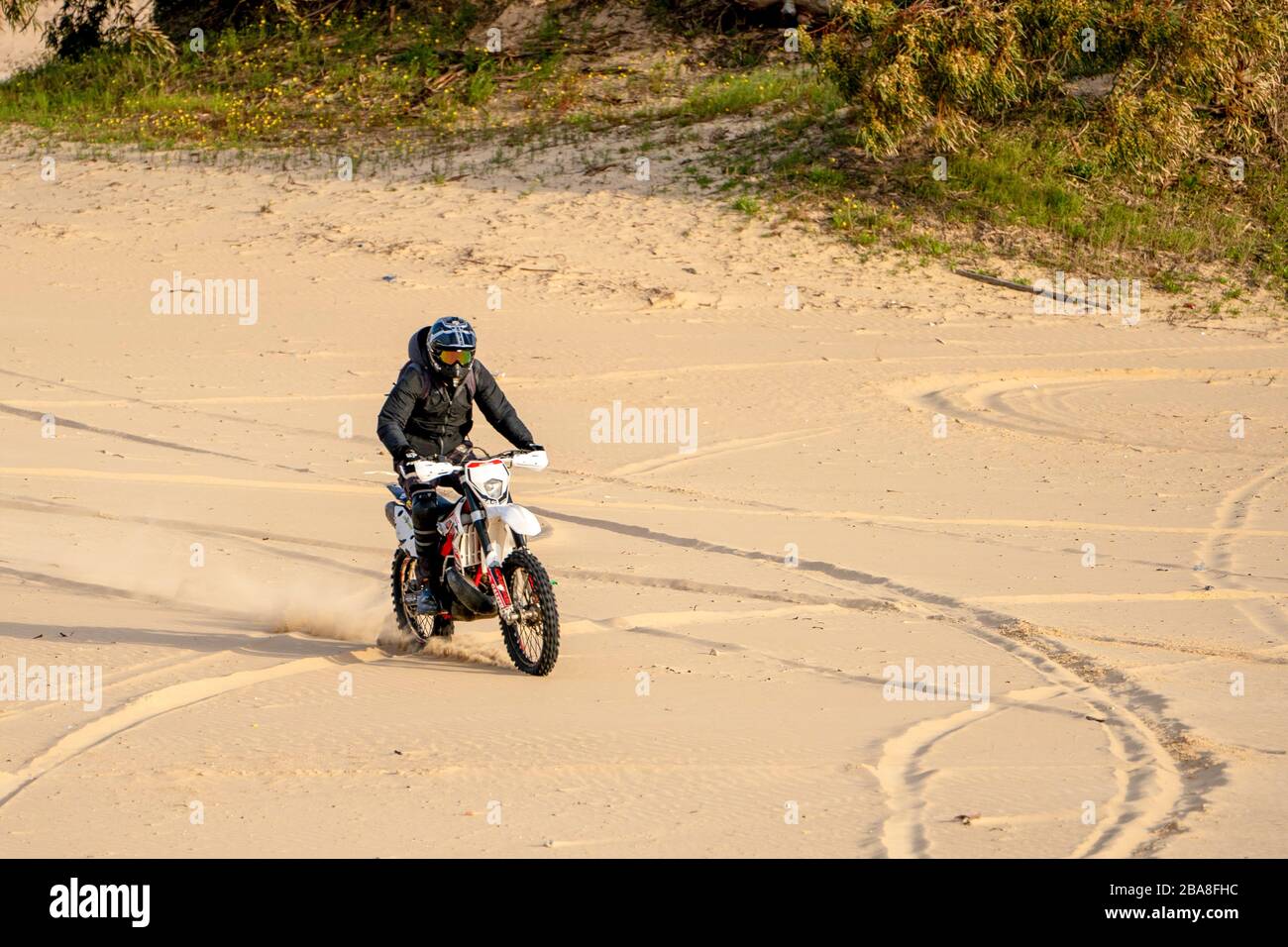 Dirt bike on a sand dune Stock Photo Alamy