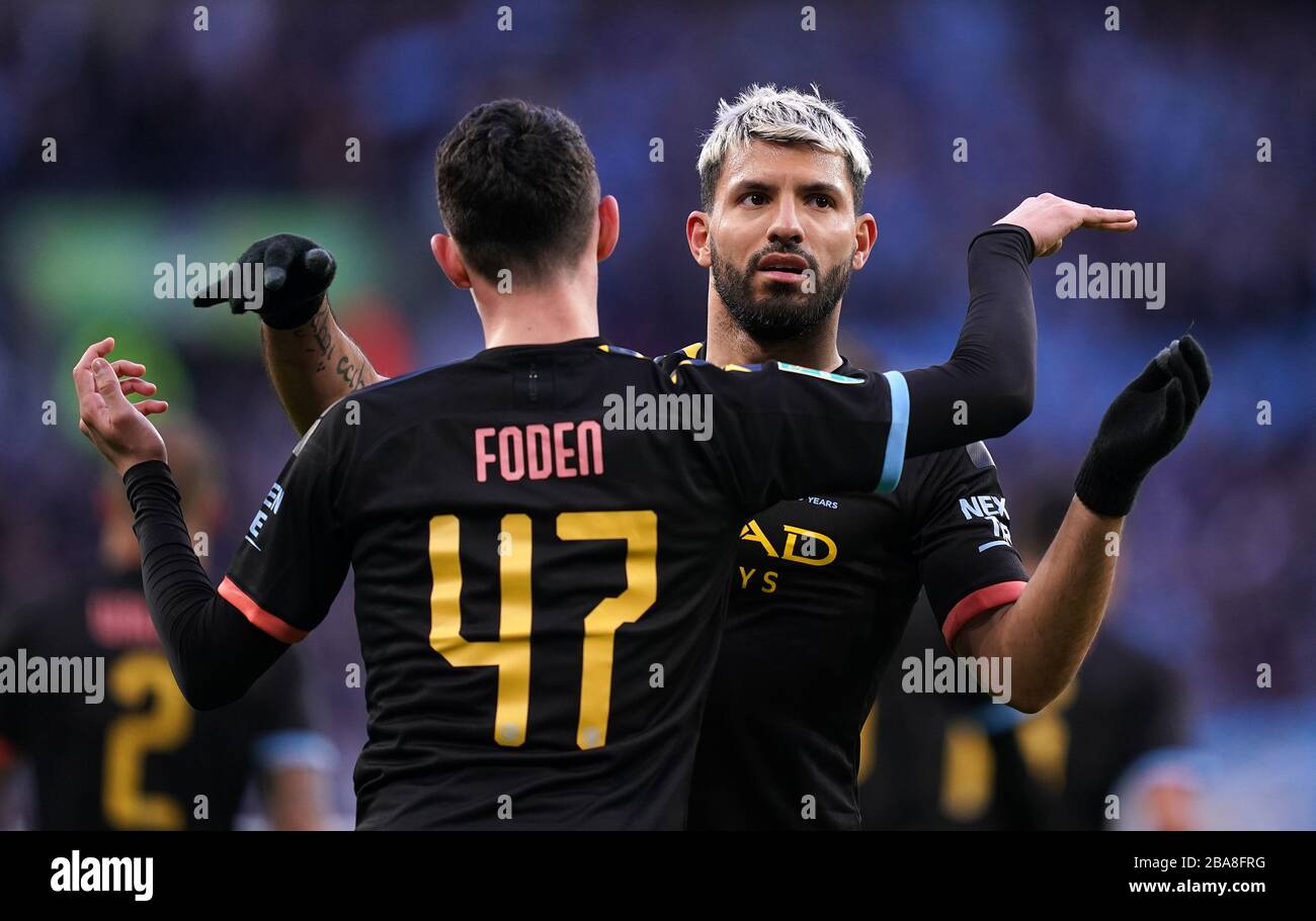 Manchester City's Sergio Aguero (right) celebrates scoring his side's first goal of the game with team-mate Phil Foden. Stock Photo