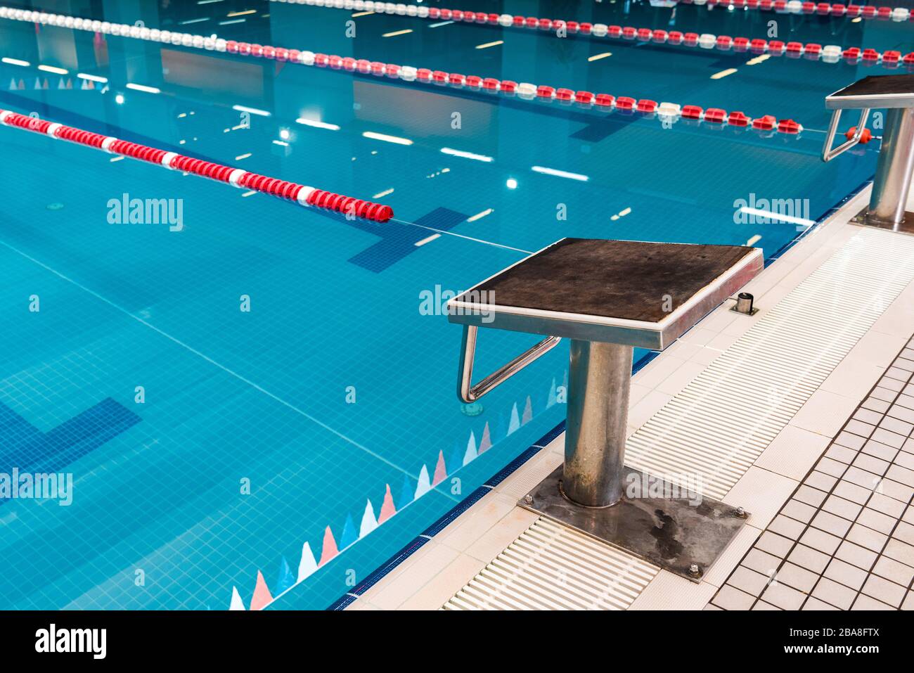 diving block near swimming pool with blue water Stock Photo Alamy