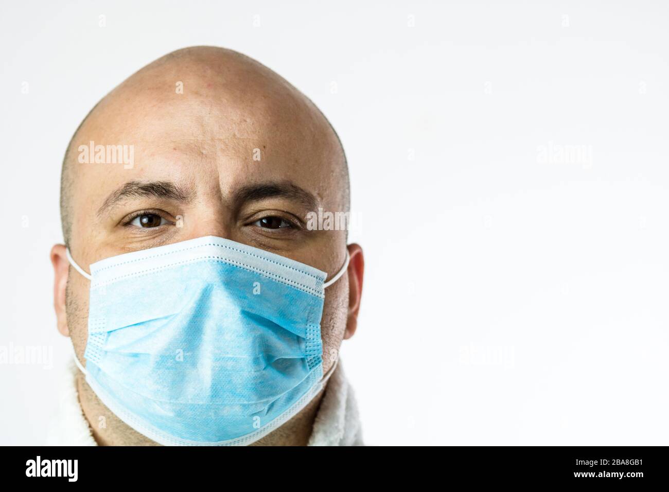 Close up photo of sick young man with medical protective face mask ...