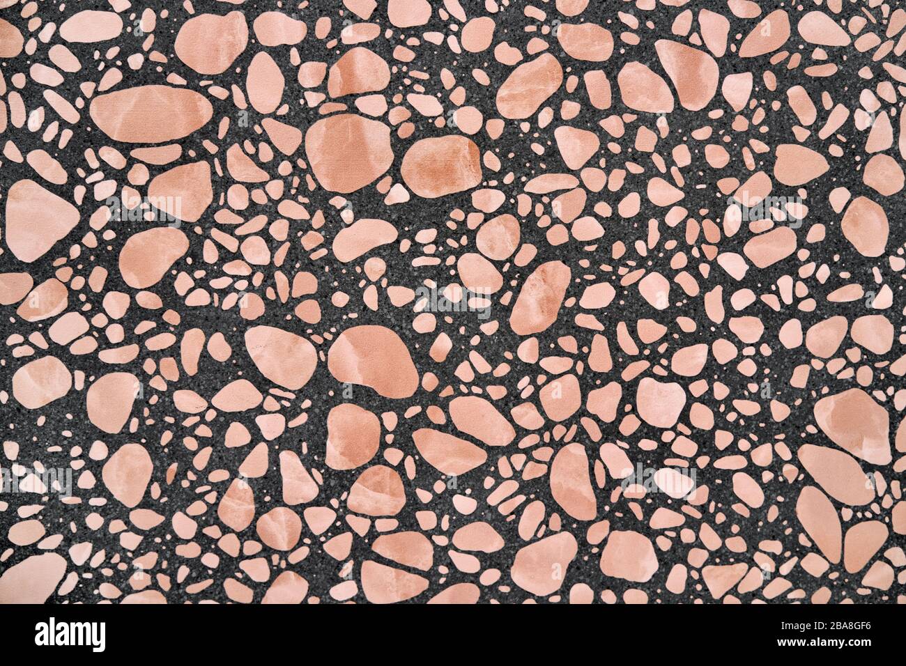 Closeup view at stone wall with geometric patterns Stock Photo
