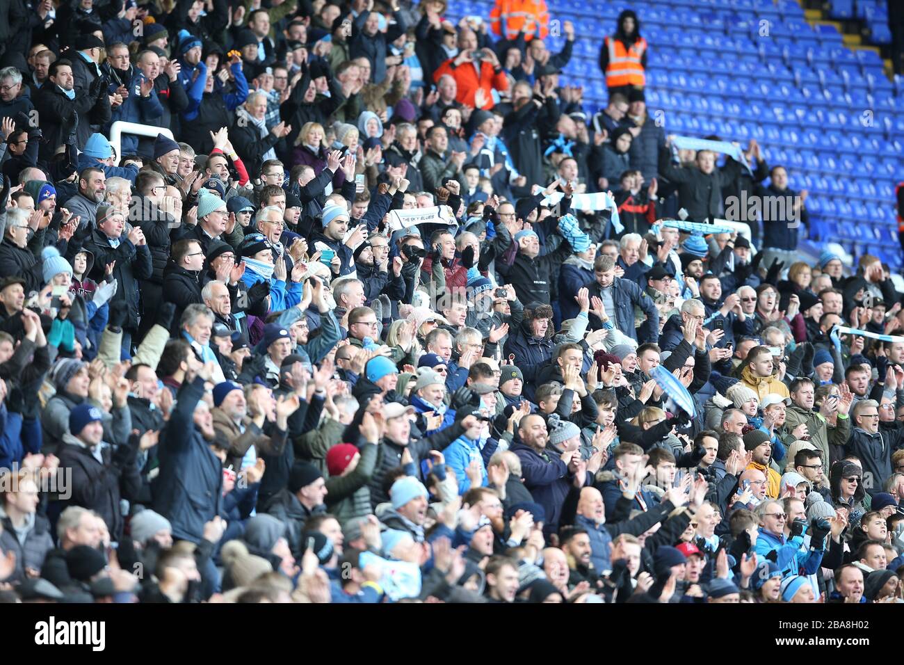 Coventry City fans in the stands Stock Photo - Alamy