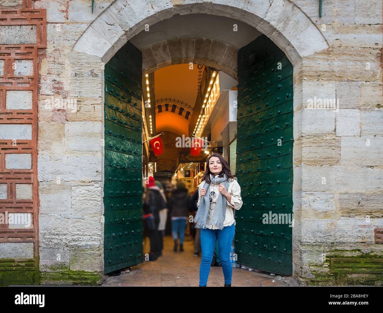 Attractive young beautiful girl poses at the gate of Egypt Bazaar in Eminonu,Istanbul,Turkey Stock Photo