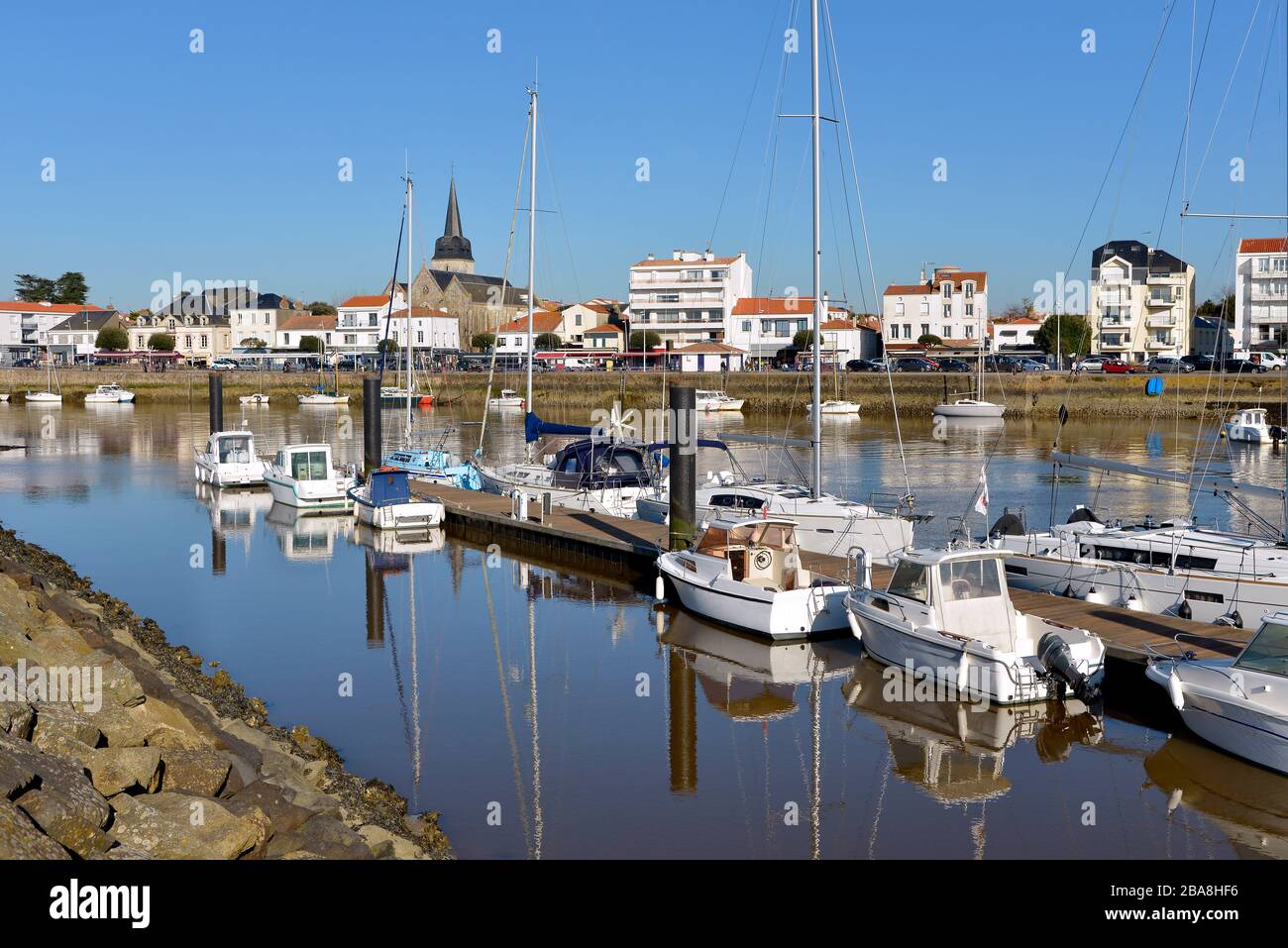 Port of Saint-Gilles-Croix-de-Vie, with Saint Gilles church in the background, commune in the Vendée department in the Pays de la Loire in France Stock Photo