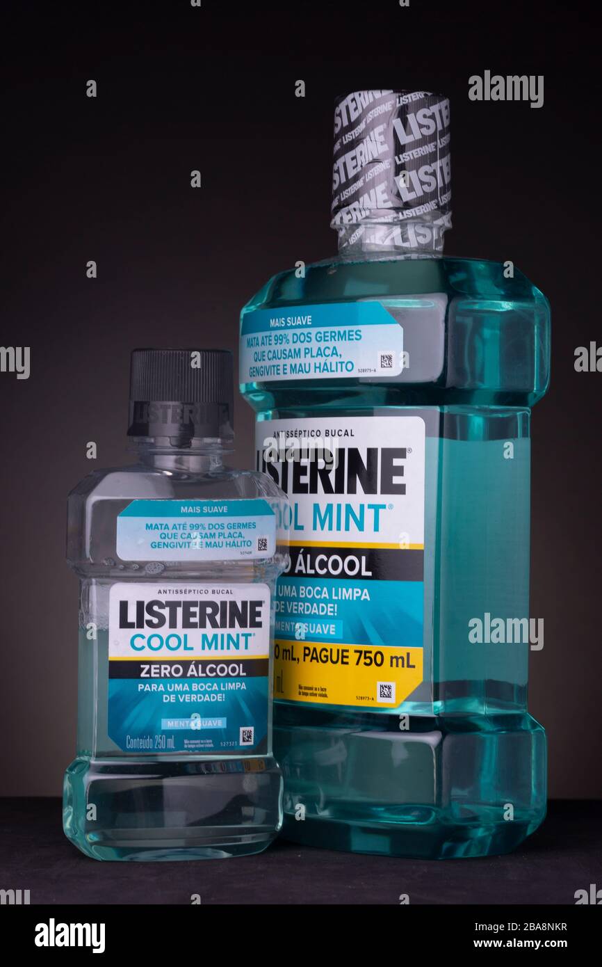 Small bottle of Listerine mouthwash next to a large unopened container