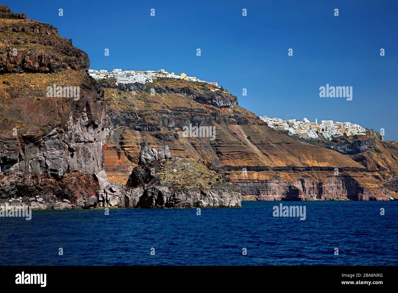 Firostefani (front) and Fira (back) villages hanging over the caldera of Santorini island, Cyclades, Aegean sea, Greece. Stock Photo